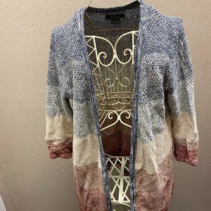 Blue, white, cream, and burgundy cardigan